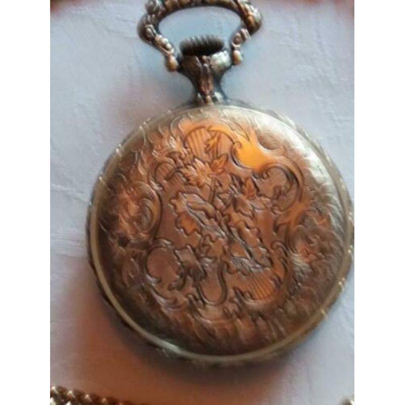 Zakhorloge met 2 paardenhoofden
