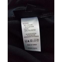 Promiss rok zwart met witte stippen. Elastische tailleband.